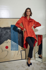 BLUSA PINGUINO CON PUÑO NARANJA